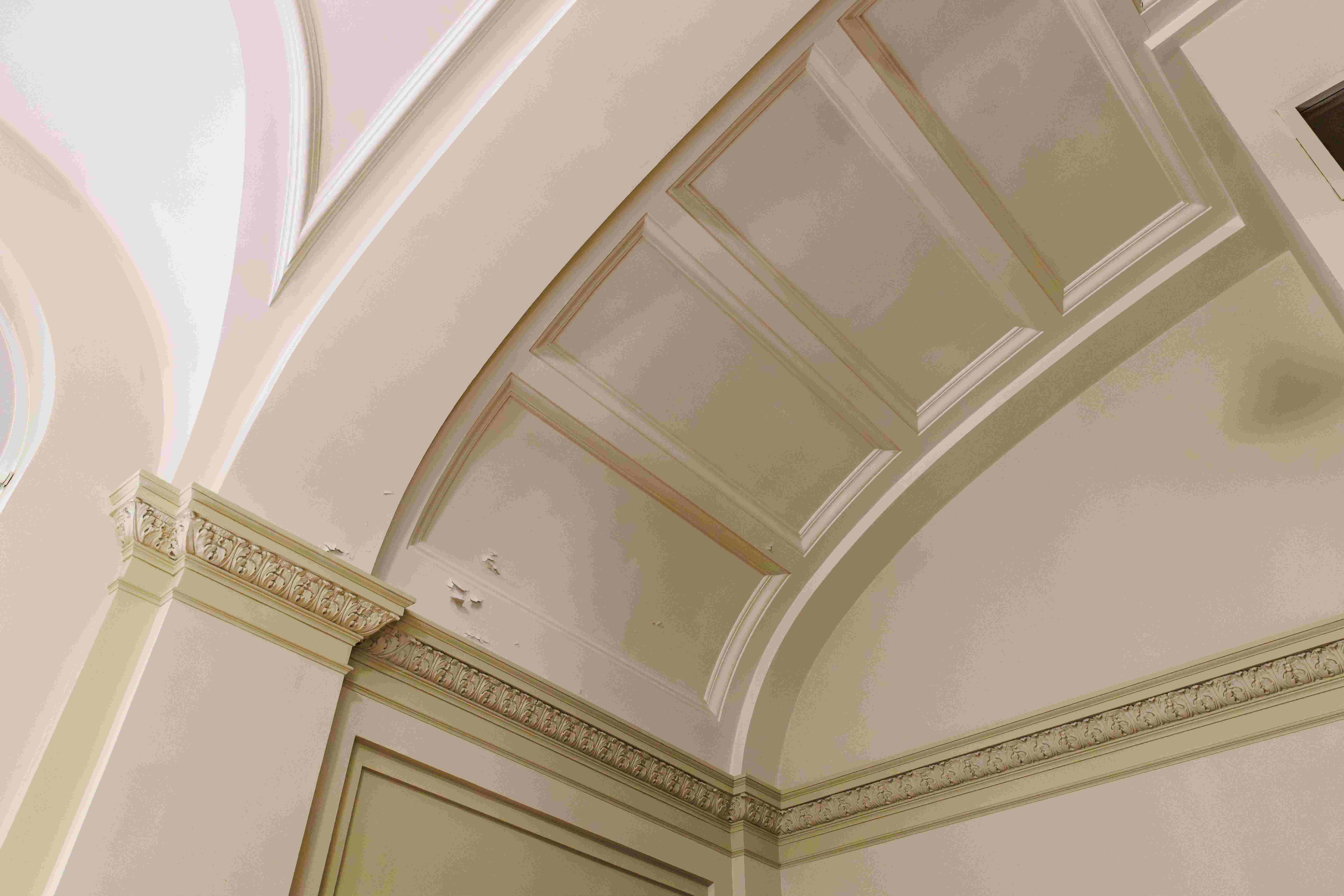 Vaulted ceiling and decorative plaster cornice detailing inside Convocation Hall at the University of Alberta.
